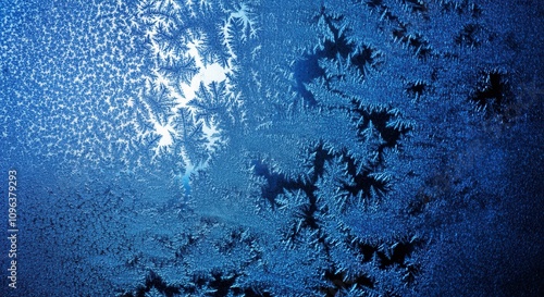 Frost patterns on blue winter window