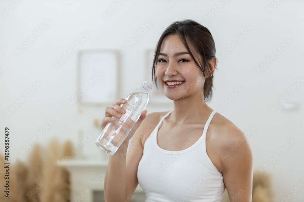 Asian young female sporty drinking water from water bottle while exercising. stay hydrated per day. Healthy fit woman fresh wellness. Drinking water makes you feel good. Asian young female sporty drinking water from water bottle while exercising. stay hydrated per day. Healthy fit woman fresh wellness. Drinking water makes you feel good.