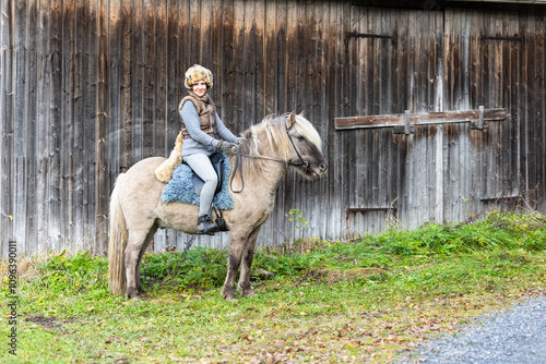 Icelandic horse riding. Rider has werewolf theme outfit