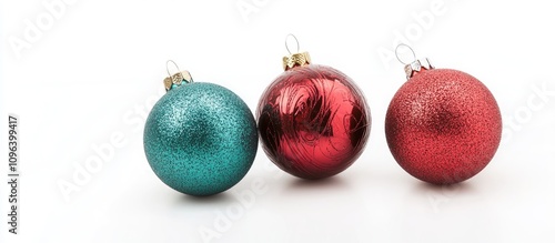 Colorful Christmas ornaments in red and teal isolated on white background ideal for festive decorations and seasonal celebrations photo