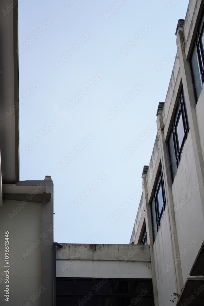 Dark gray building with blue sky without clouds Dark gray building with blue sky without clouds