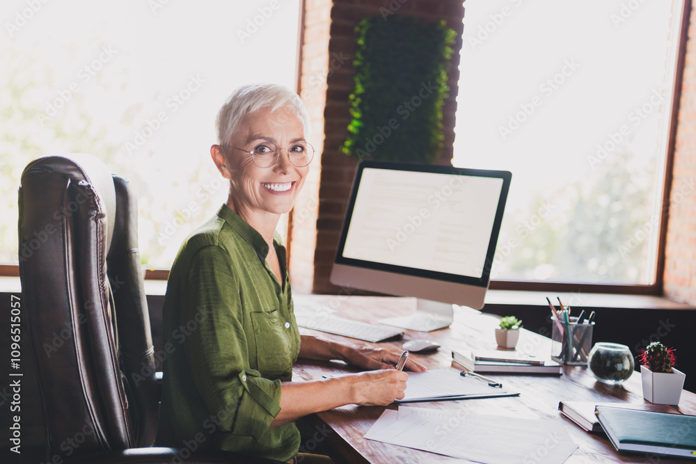 Profile photo of successful aged business lady write clipboard document wear shirt modern loft interior office indoors Profile photo of successful aged business lady write clipboard document wear shirt modern loft interior office indoors