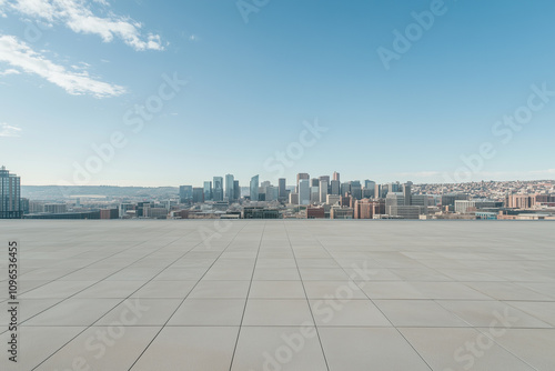 Empty Rooftop with City Skyline and Clear Blue Sky