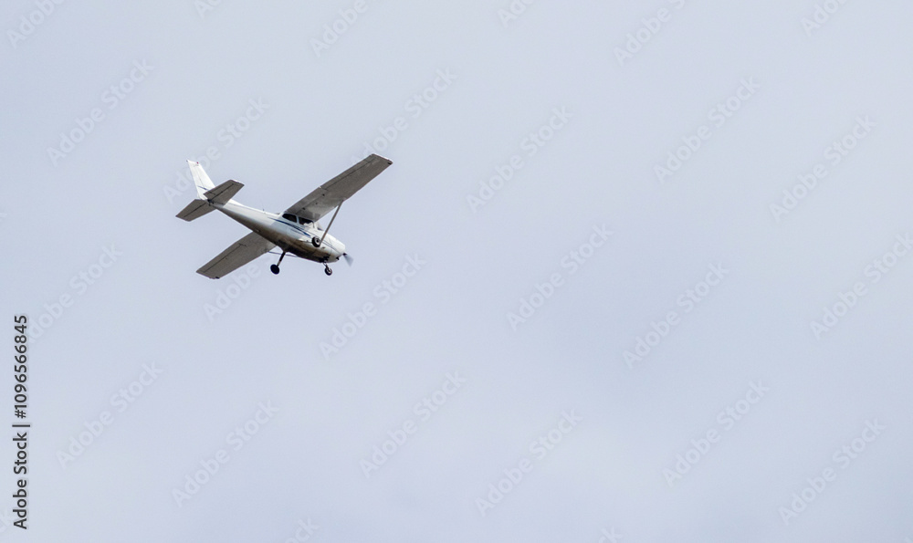 
a small passenger plane in flight in the sky