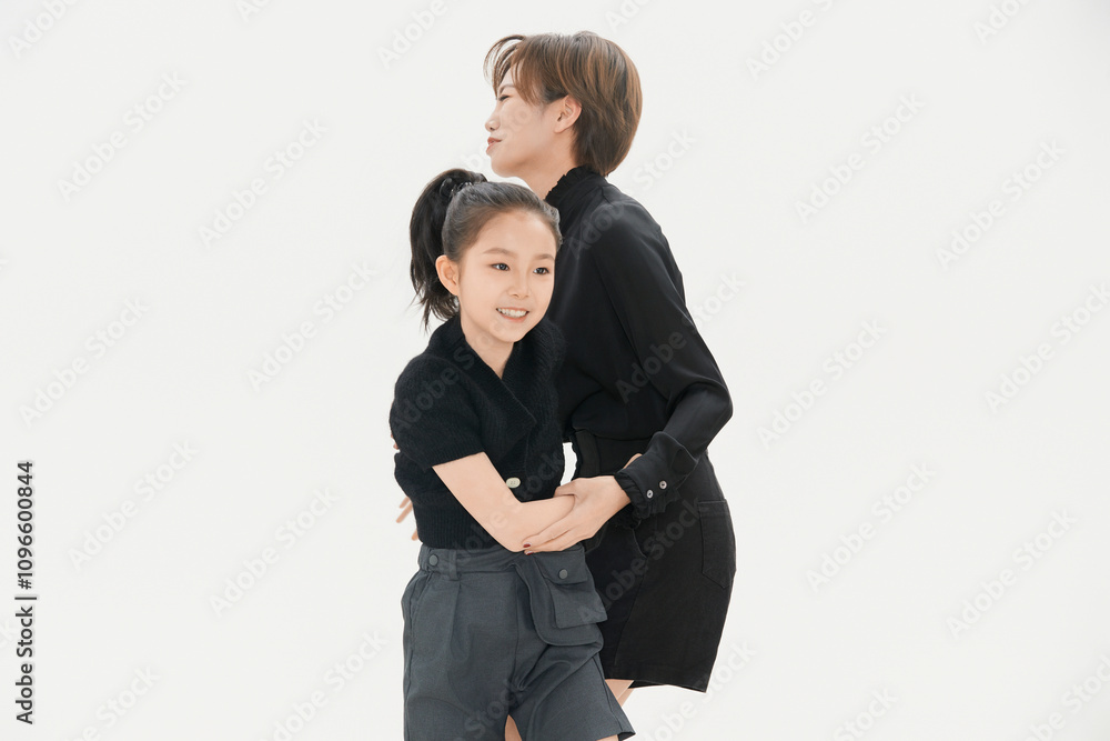 Beautiful mother and cute daughter portrait on white background Beautiful mother and cute daughter portrait on white background