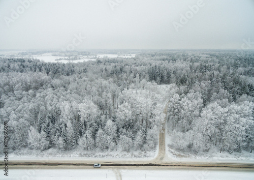 Winter Landscape. Snowy Forest and Road With Vehicle in Foreground