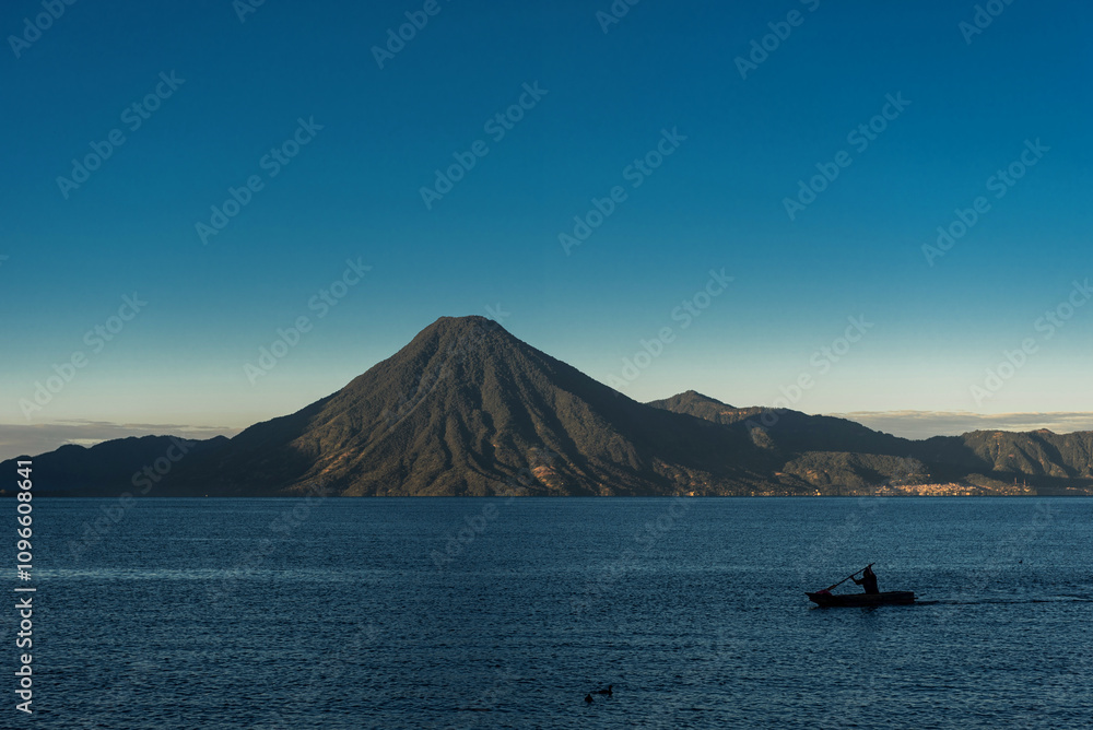 Atitlan Lake in Guatemala. Long Exposure. Volcano in Background. Morning Light. Atitlan Lake in Guatemala. Long Exposure. Volcano in Background. Morning Light.
