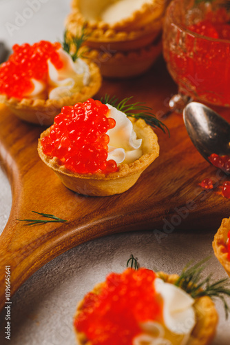 Tartlets with red caviar and cottage cheese