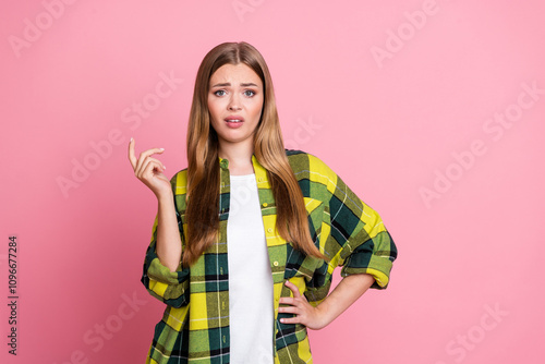 Photo portrait of attractive young woman annoyed disgusted arrogant dressed stylish yellow plaid clothes isolated on pink color background