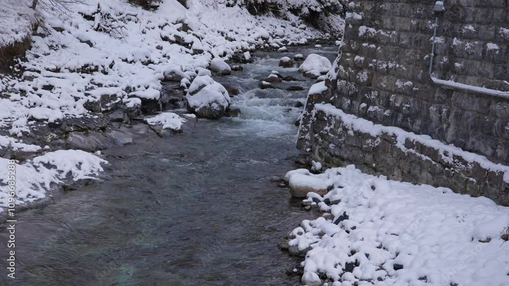 Snowy landscape at Filisur Albula with Landwasser River in the Swiss Alps on a snowy autumn day. Movie shot November 22nd, 2024, Filisur Albula, Switzerland. Snowy landscape at Filisur Albula with Landwasser River in the Swiss Alps on a snowy autumn day. Movie shot November 22nd, 2024, Filisur Albula, Switzerland.