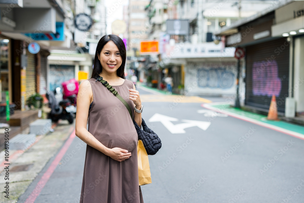 Asian pregnant woman in the city Asian pregnant woman in the city
