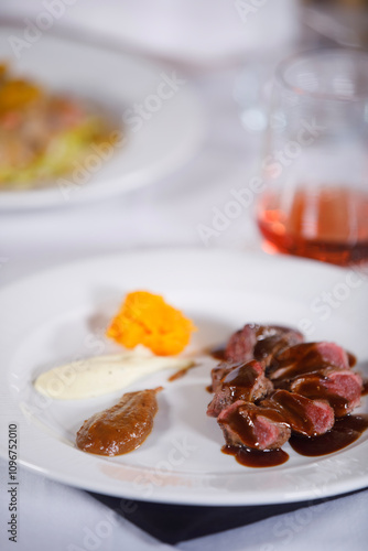 Ready to be eat, plate of cooked meat with sauces in side