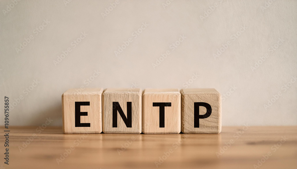 Wooden cubes with abbreviation ENTP on table. Extraverted, Ntuitive, Thinking, Perceiving. Wooden cubes with abbreviation ENTP on table. Extraverted, Ntuitive, Thinking, Perceiving.