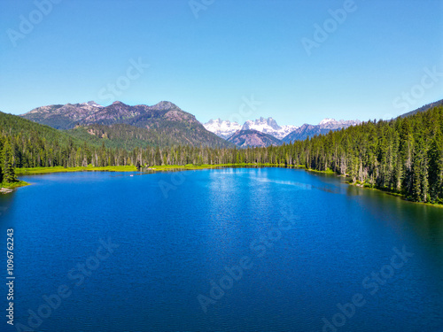 Nature landscape. Cooper Lake in Washington. Scenic nature of popular hiking Cooper lake. Cooper lake with mountain landscape. Landscape of mountain and forest of Cooper lake. Outdoor photography