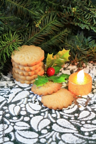 Christmas butter cookies burning candle and pine needles