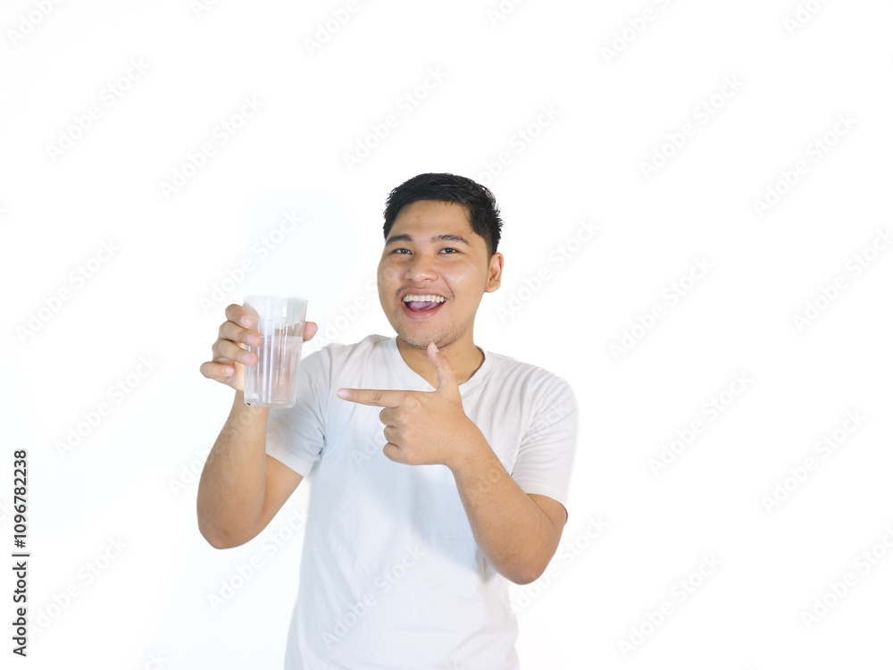 Handsome asian man white shirt hold glass of water gentle smile isolated Handsome asian man white shirt hold glass of water gentle smile isolated