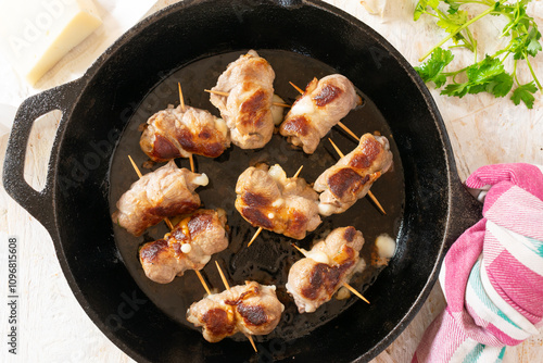 Traditional Italian meat rolls stuffed with cheese and herbs, called Bombette Pugliesi. photo