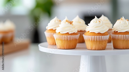 A collection of cupcakes with elegantly swirled frosting, presented on a stand. Each cupcake looks carefully crafted, appealing to sweet cravings.