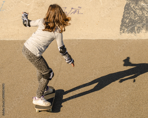 Little girl riding skateboard