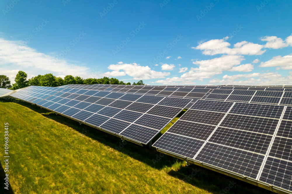 Solar power cells panels at power station in the field aerial. Green energy and ecology innovation for preservation of nature and avoid environment impact. Photovoltaic solar panels technologies Solar power cells panels at power station in the field aerial. Green energy and ecology innovation for preservation of nature and avoid environment impact. Photovoltaic solar panels technologies
