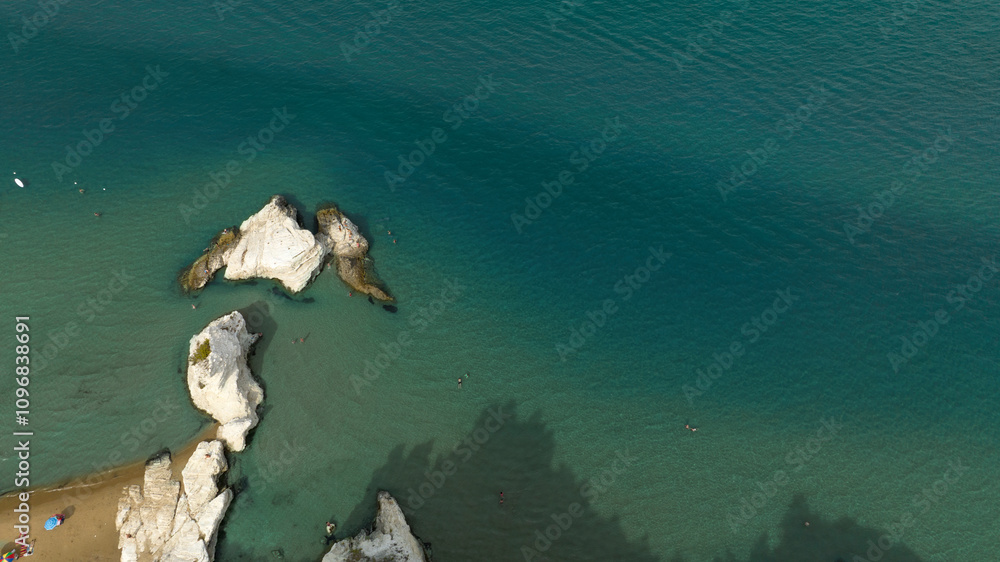 Obraz premium Aerial view of stacks in the crystal blue sea. Rocky coast.