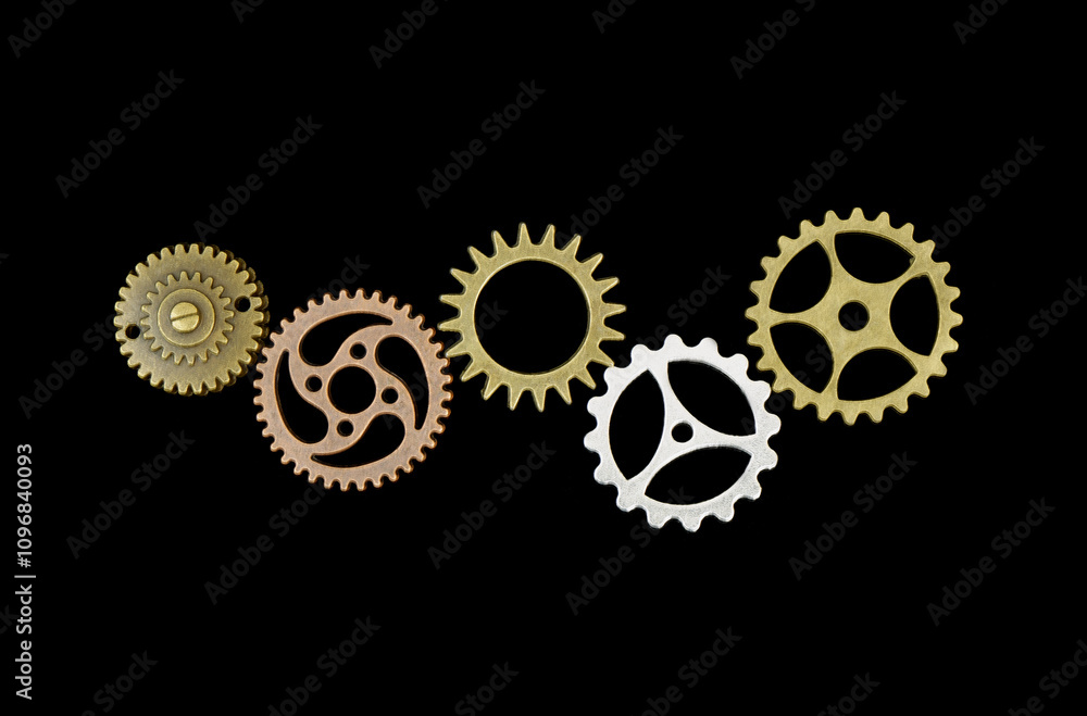 Connected different gear wheels isolated on black background. Partnership, cooperation, teamwork, community concept. Connected different gear wheels isolated on black background. Partnership, cooperation, teamwork, community concept.