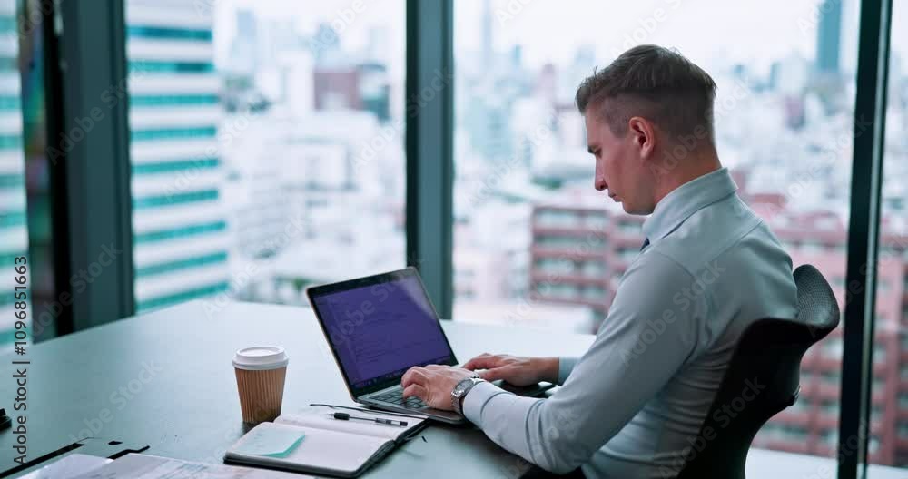 Business, typing and man at desk, laptop and financial report with economy analyst in modern office. Person, employee and consultant with notebook, computer and schedule with investment and Japan Business, typing and man at desk, laptop and financial report with economy analyst in modern office. Person, employee and consultant with notebook, computer and schedule with investment and Japan
