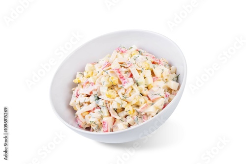 Imitation crab meat corn cucumber salad in a bowl on a white isolated background