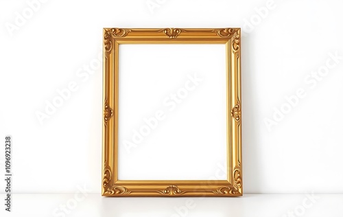 A simple, elegant wooden picture frame sits on a white desk against a plain white wall, illuminated by bright natural daylight.