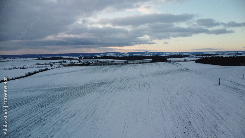 Obraz premium A stunning view of the Czech winter landscape covered in fresh snow, capturing the serene beauty of nature.