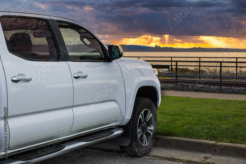 White Pickup truck American 4X4 SUV off-road vehicle exterior parked by the beach. photo