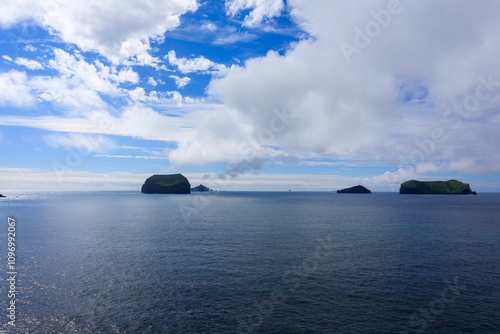 Vestmannaeyjar island beach view with Surtsey island in background in Iceland photo