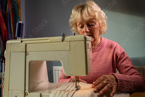 A hobbyist using an electric  sewing machine
