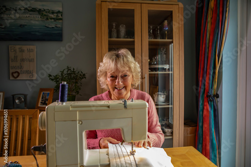 A hobbyist using an electric  sewing machine
