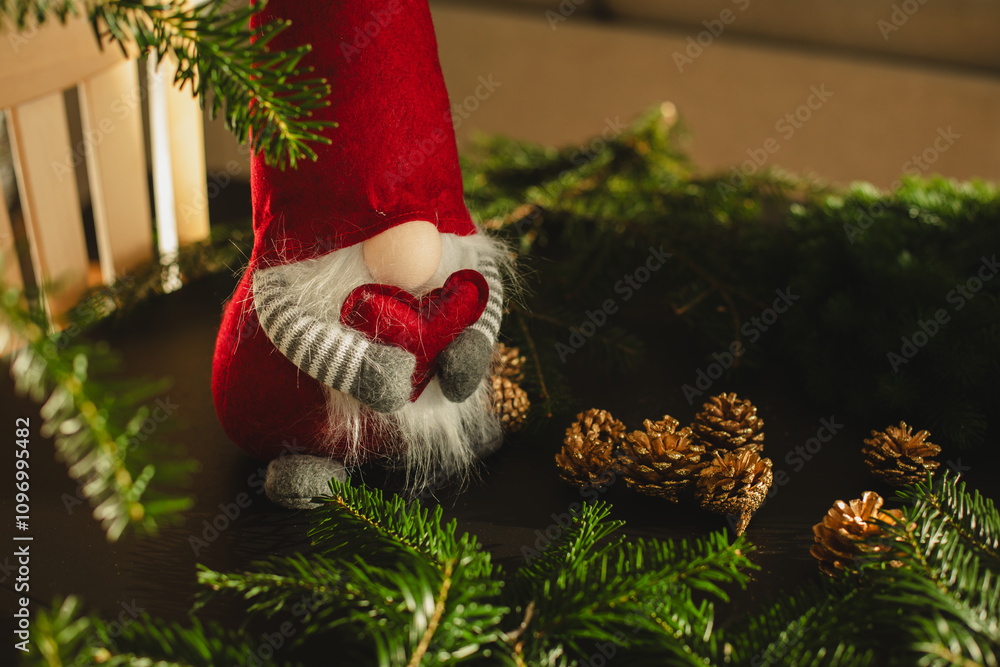 Obraz premium Christmas gnome to enhance your holiday decor Christmas advent decoration Concept for Christmas or New Year greeting card mock up. with copy space image. Place for adding text or design