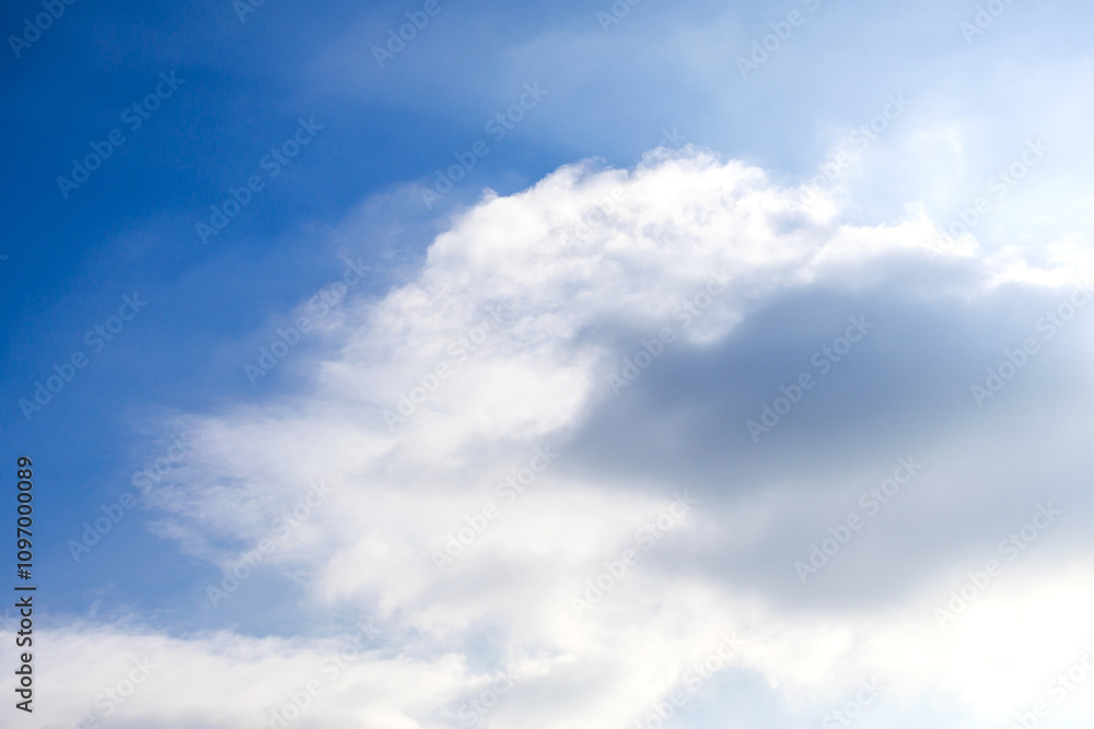 Beautiful clouds drifting in a clear blue sky during a sunny day in early autumn Beautiful clouds drifting in a clear blue sky during a sunny day in early autumn