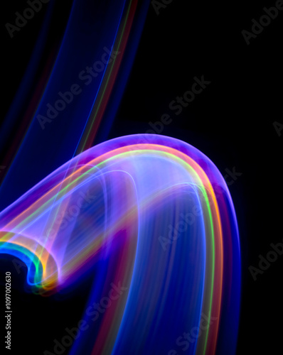 Abstract Background With Blurry Lines of Rainbow Colors. Modern Layout with Colorful Wavy Lines on a Black Background. Smooth Glowing Smoke of Neon Colors. Futuristic Layout. Simple Flowing Steam.