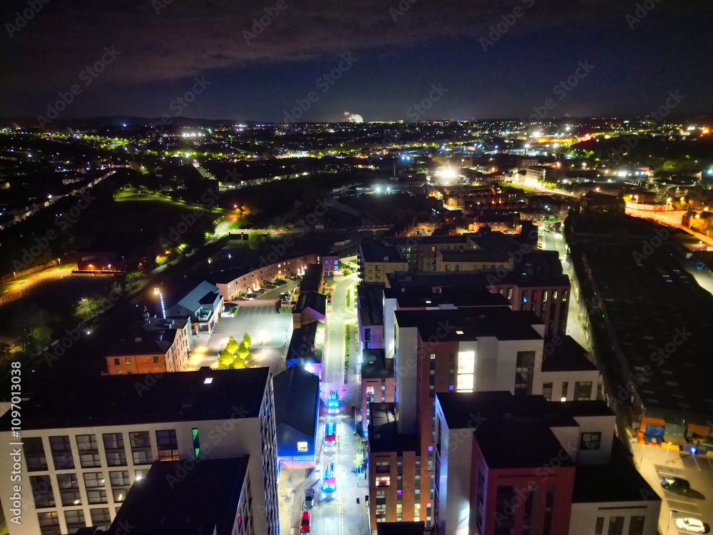 Fototapeta premium High Angle View of Illuminated Historical Central Leicester City of England UK at Night. Aerial Footage Was Captured with Drone's Camera During Midnight of April 26th, 2024 from Medium High Altitude.