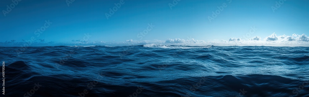 Ocean waves under a clear sky during midday in a serene location Ocean waves under a clear sky during midday in a serene location