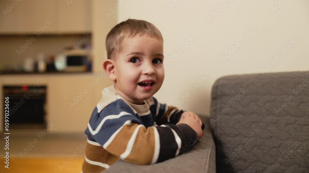 A joyful toddler beams a bright smile in a cozy living room, radiating warmth, comfort, and pure happiness A joyful toddler beams a bright smile in a cozy living room, radiating warmth, comfort, and pure happiness