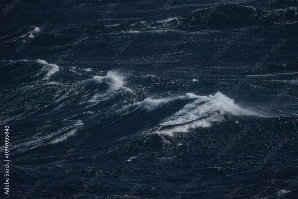 Dark ocean waves crashing against each other, creating dramatic seascape. turbulent water reflects sense of power and nature beauty Dark ocean waves crashing against each other, creating dramatic seascape. turbulent water reflects sense of power and nature beauty