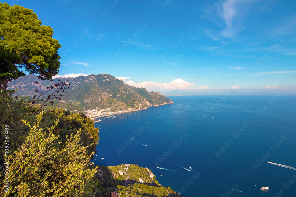 The photo showcases the scenic villas of Ravello and its surroundings, set atop cliffs with panoramic views, lush gardens, and charming architecture that capture the essence of Italy’s Amalfi Coast.