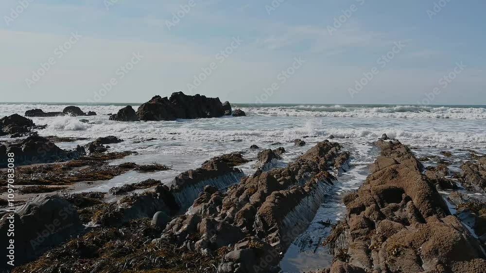 Tough rocks forever getting hit by incoming tides Tough rocks forever getting hit by incoming tides