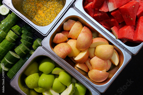 Colorful assortment of fresh fruits and vegetables in preparation for a delicious dish.