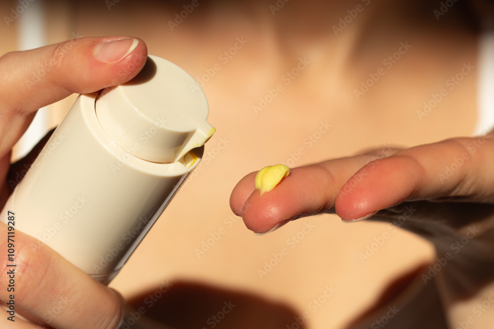Closeup of person applying retinal serum.