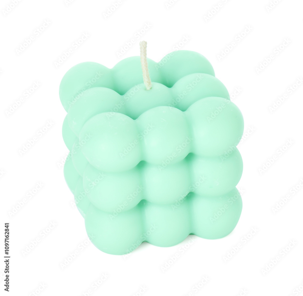 Obraz premium Beautiful turquoise bubble candle isolated on white