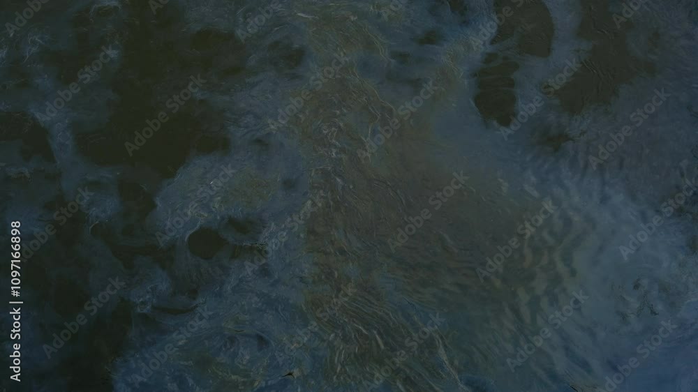 River top view. Oil petrol water pollution. Ecological disaster. spilled gasoline rainbow background, industrial hazard spill pollution, texture River top view. Oil petrol water pollution. Ecological disaster. spilled gasoline rainbow background, industrial hazard spill pollution, texture