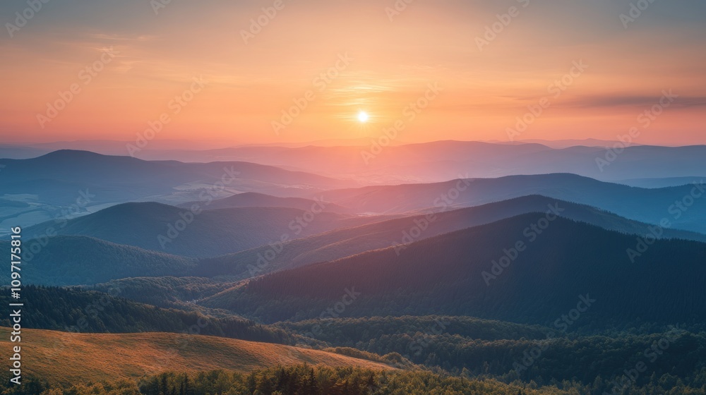 Obraz premium Majestic Sunset Over Rolling Mountain Ranges