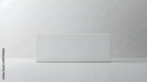 A blank, white rectangular box sits on a white surface against a white background.