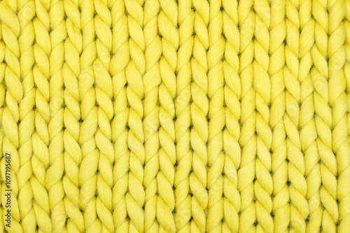 Close-Up of Bright Yellow Chunky Knit Wool Texture – Perfect for Cozy Home Decor, Knitting Projects, Crafting Ideas, and Vibrant Handmade Textile Inspiration photo